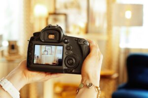 A professional photographer photographing a home’s interior