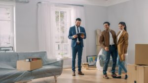 A real estate agent showing a house to a couple